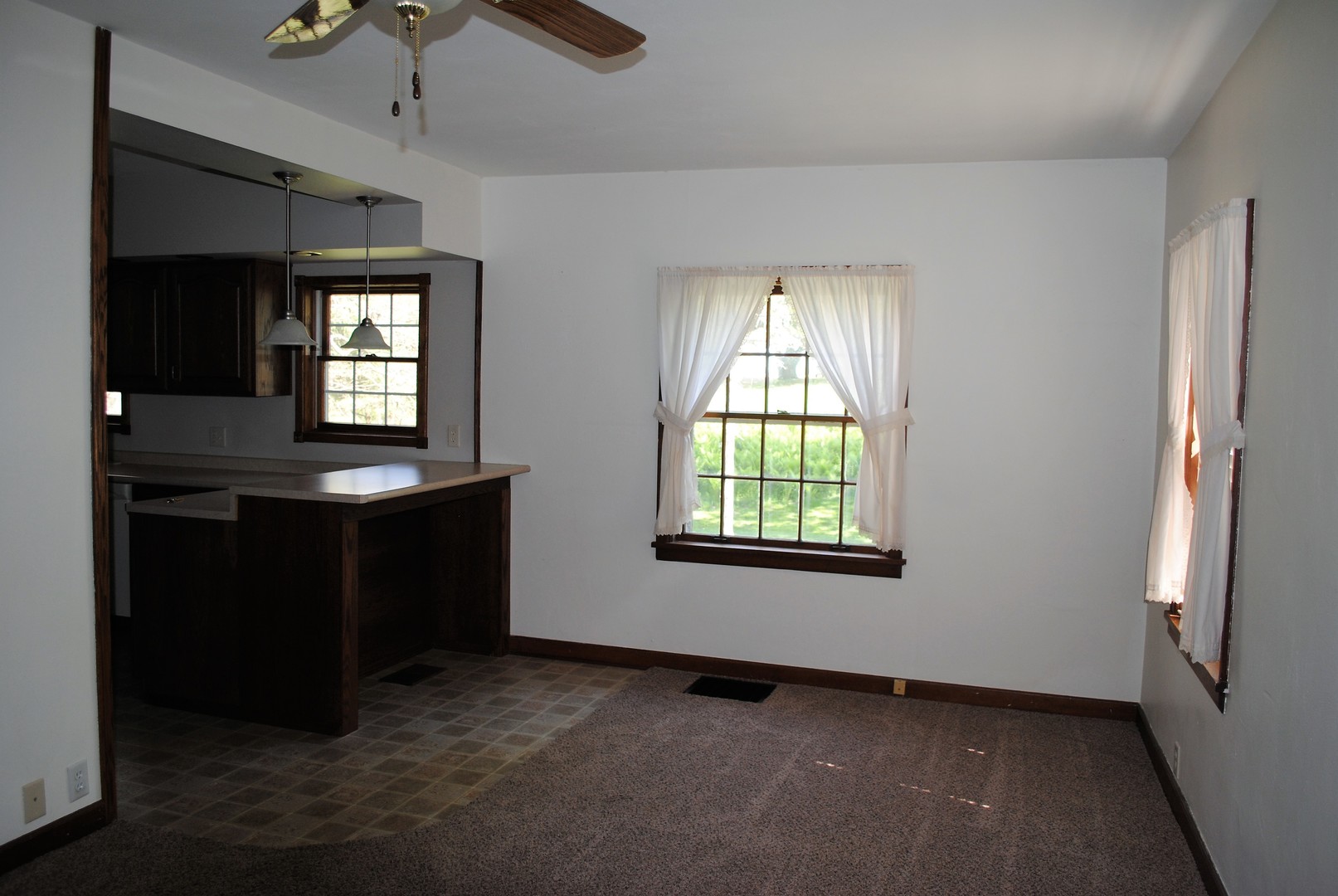 208 Ridge Street Mount Carroll, IL 61053 - Photo 6 of 16 a view of an empty room with a window