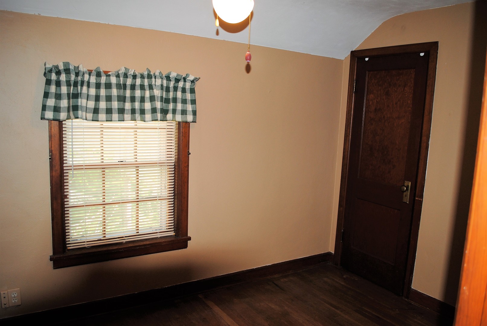 208 Ridge Street Mount Carroll, IL 61053 - Photo 10 of 16 an empty room with wooden floor and windows
