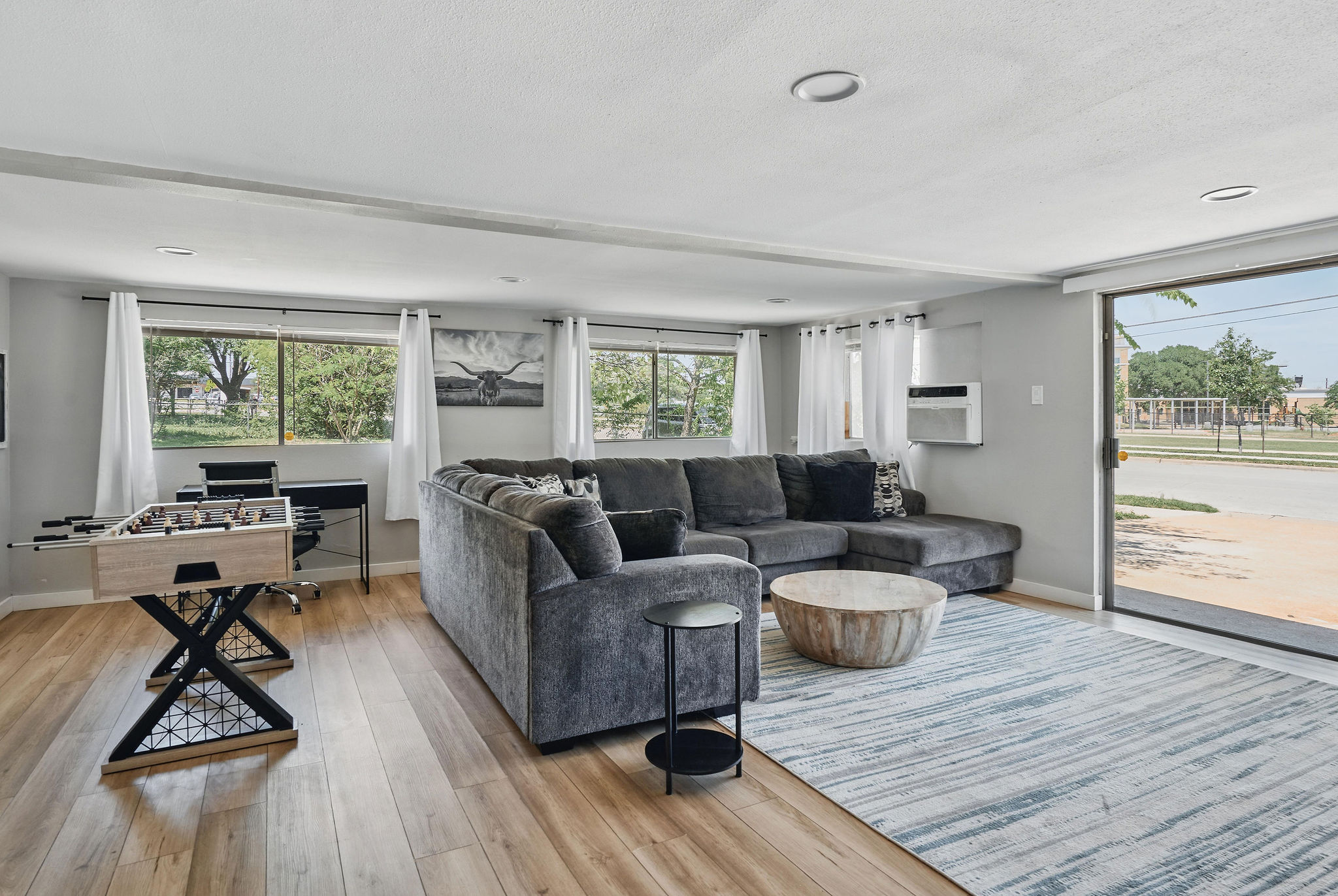7706 Delafield Lane Austin, TX 78752 - Photo 15 of 28 Living area with light wood-type flooring and recessed lighting