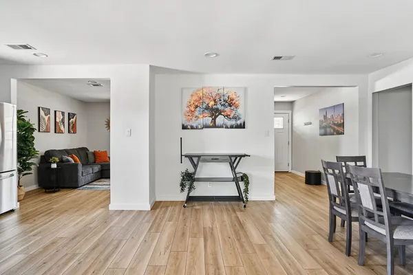 a view of a livingroom with furniture and wooden floor