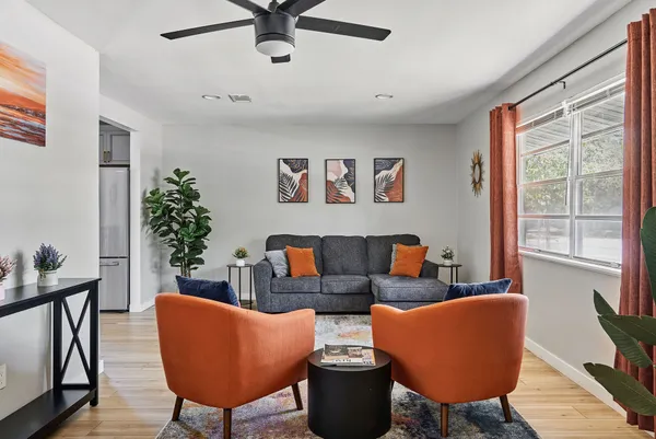 a living room with furniture and a window