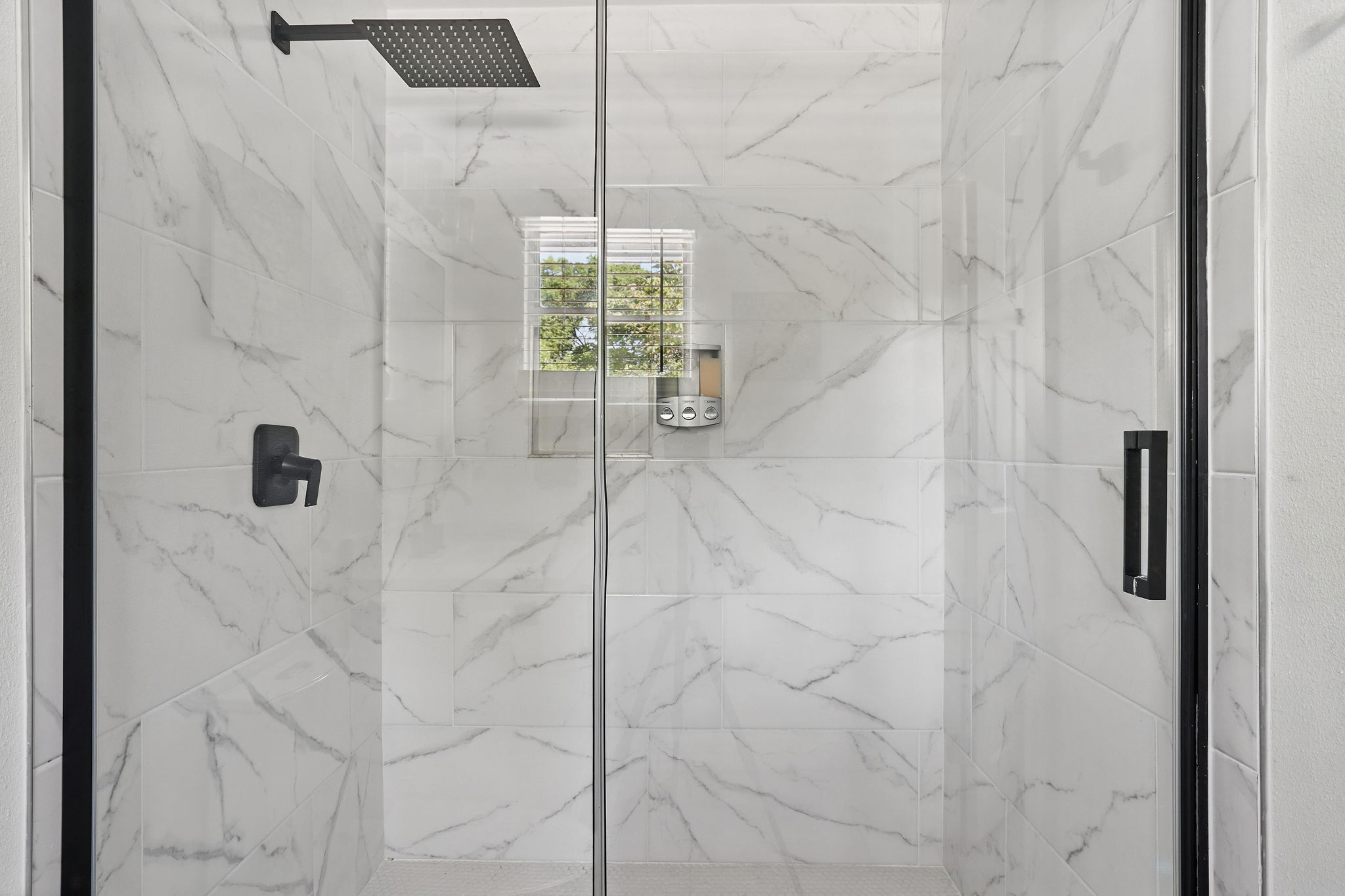 7706 Delafield Lane Austin, TX 78752 - Photo 21 of 28 Full bath with a marble finish shower