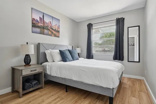 a bedroom with a bed and a fireplace