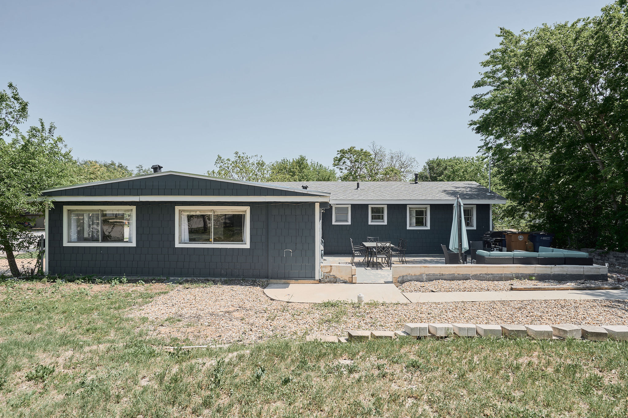 7706 Delafield Lane Austin, TX 78752 - Photo 5 of 28 Rear view of house featuring a patio area and a yard