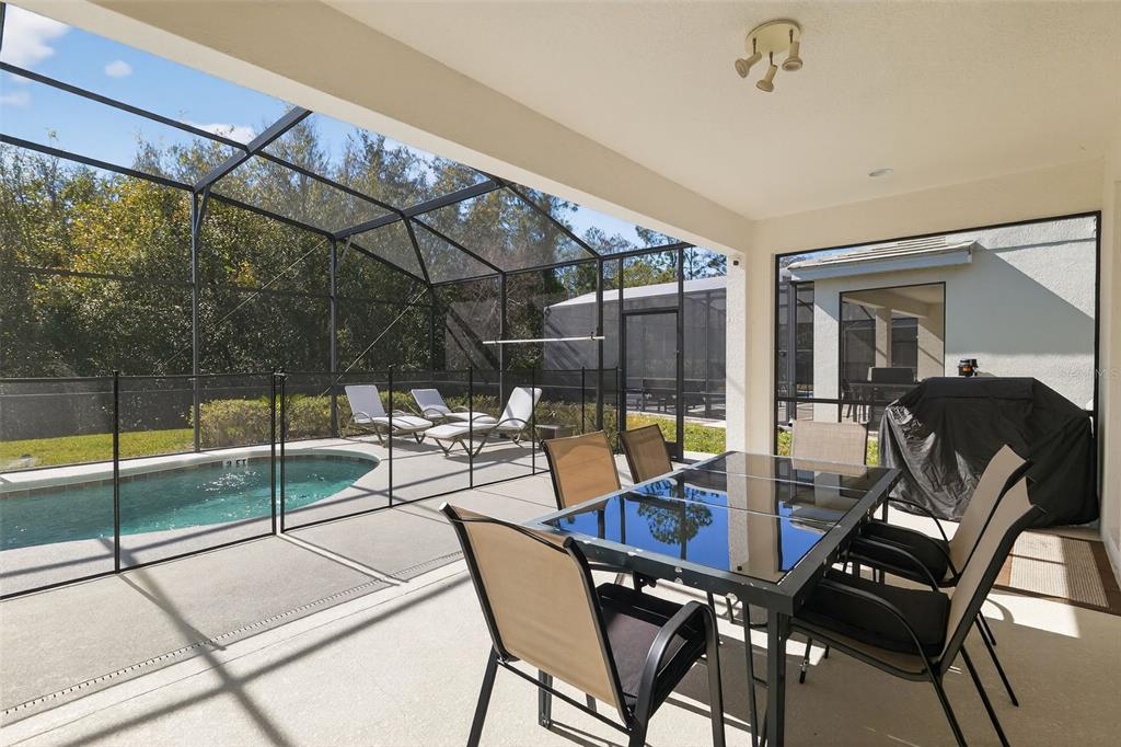 4577 Cabello Loop Kissimmee, FL 34746 - Photo 12 of 37 a view of a dining room with furniture and chandelier