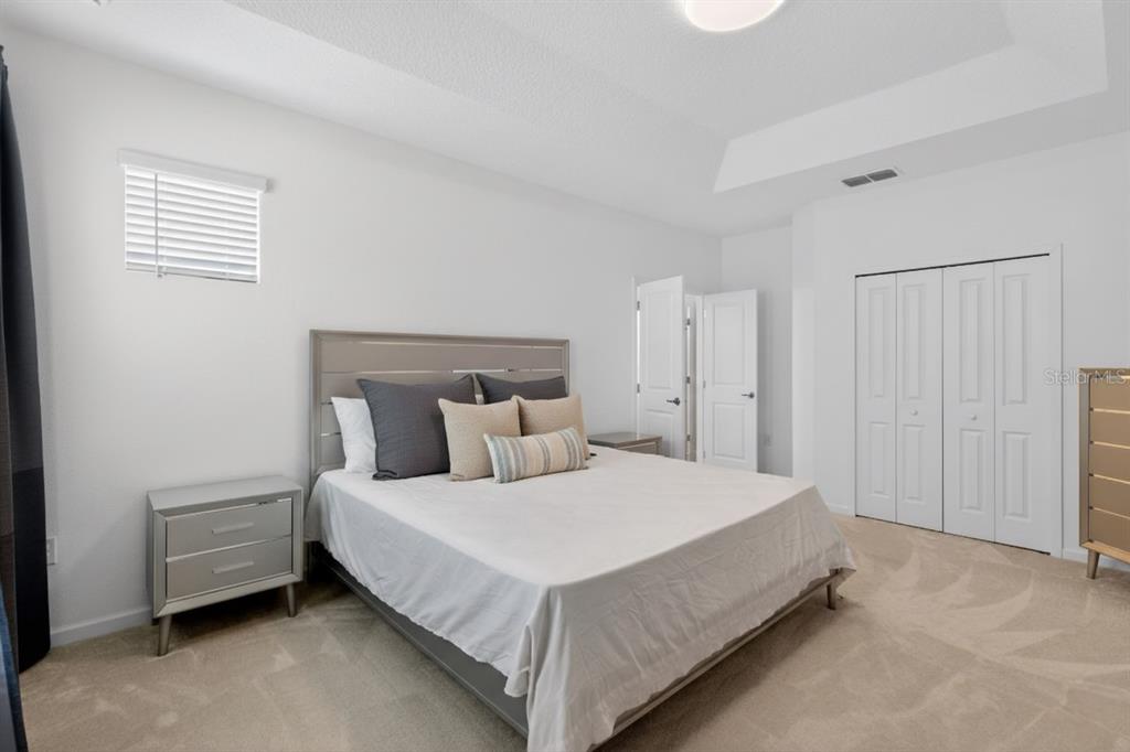 4577 Cabello Loop Kissimmee, FL 34746 - Photo 19 of 37 a bedroom with a bed and a window