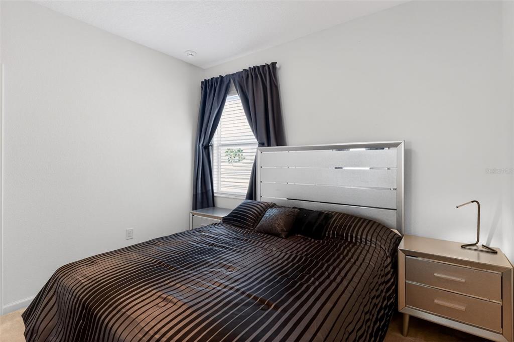 4577 Cabello Loop Kissimmee, FL 34746 - Photo 27 of 37 a bedroom with a bed and window