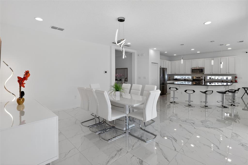 4577 Cabello Loop Kissimmee, FL 34746 - Photo 9 of 37 a view of a dining room with furniture