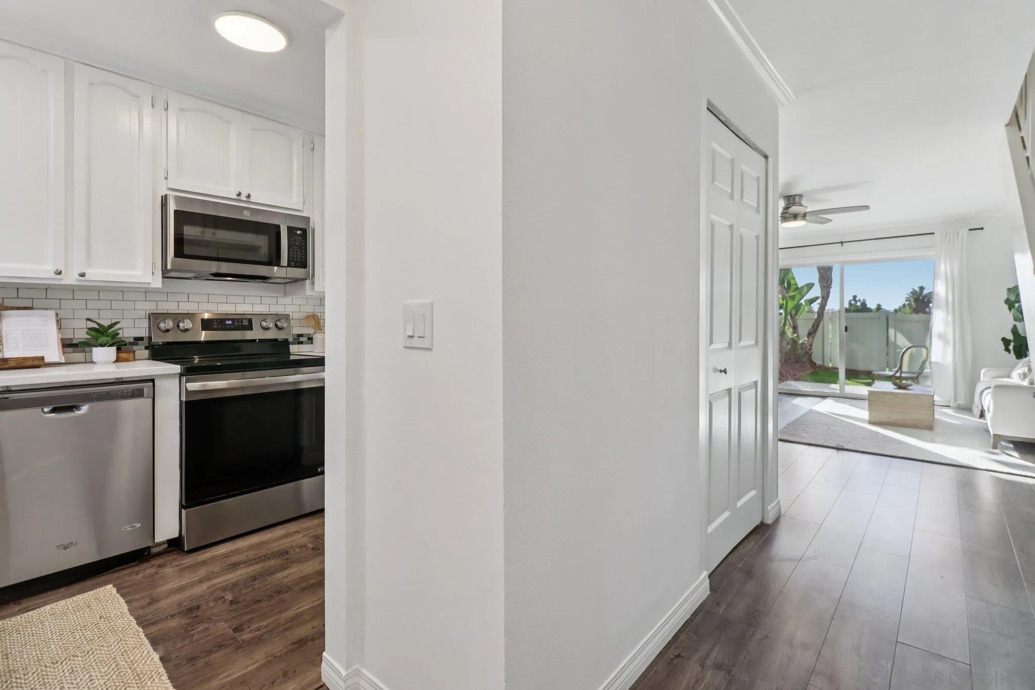 324 Countrywood Lane Encinitas, CA 92024 - Photo 11 of 42 a kitchen with stainless steel appliances a stove a microwave and a hard wood floors