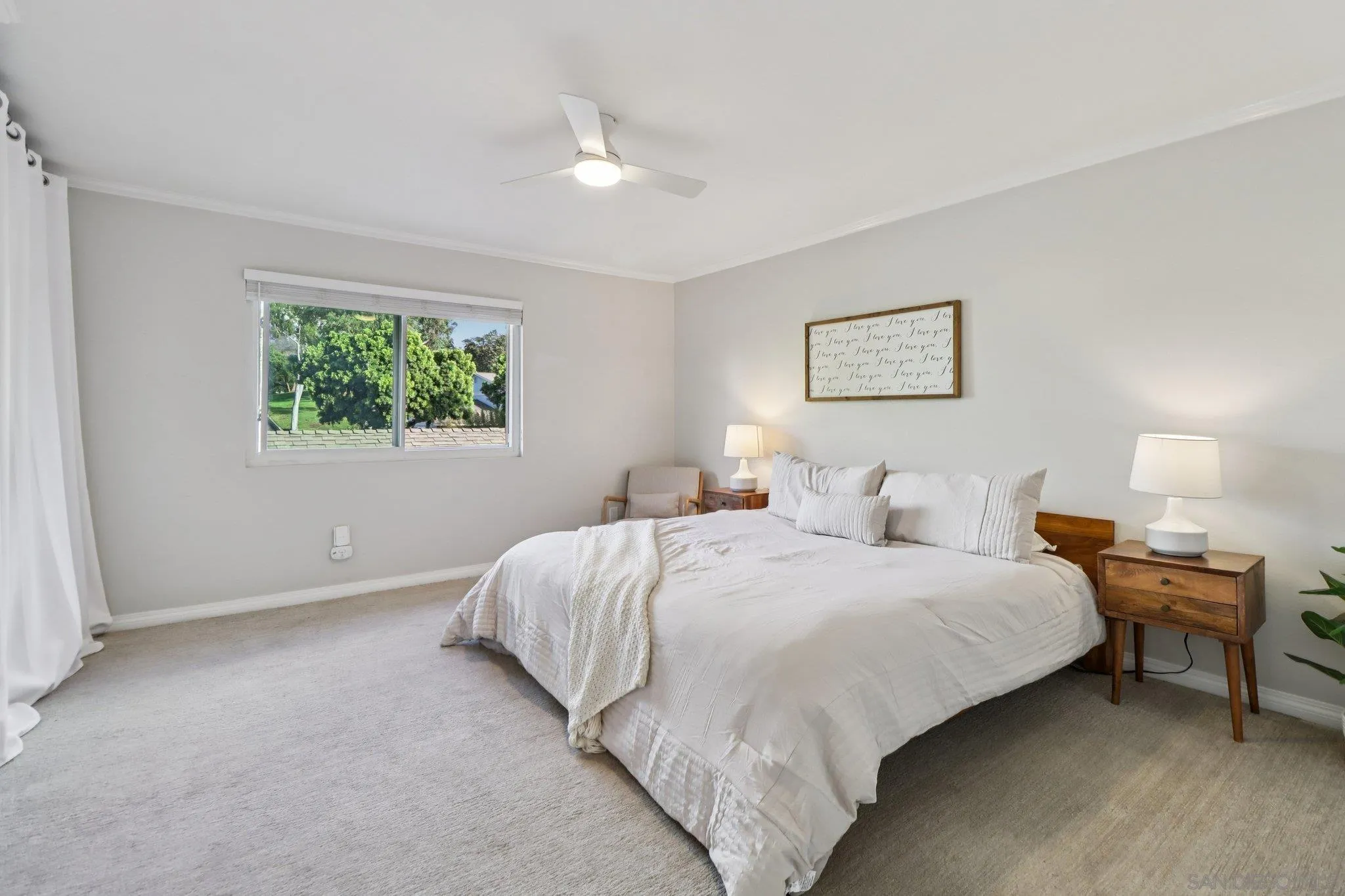 324 Countrywood Lane Encinitas, CA 92024 - Photo 17 of 42 a bedroom with bed and a window