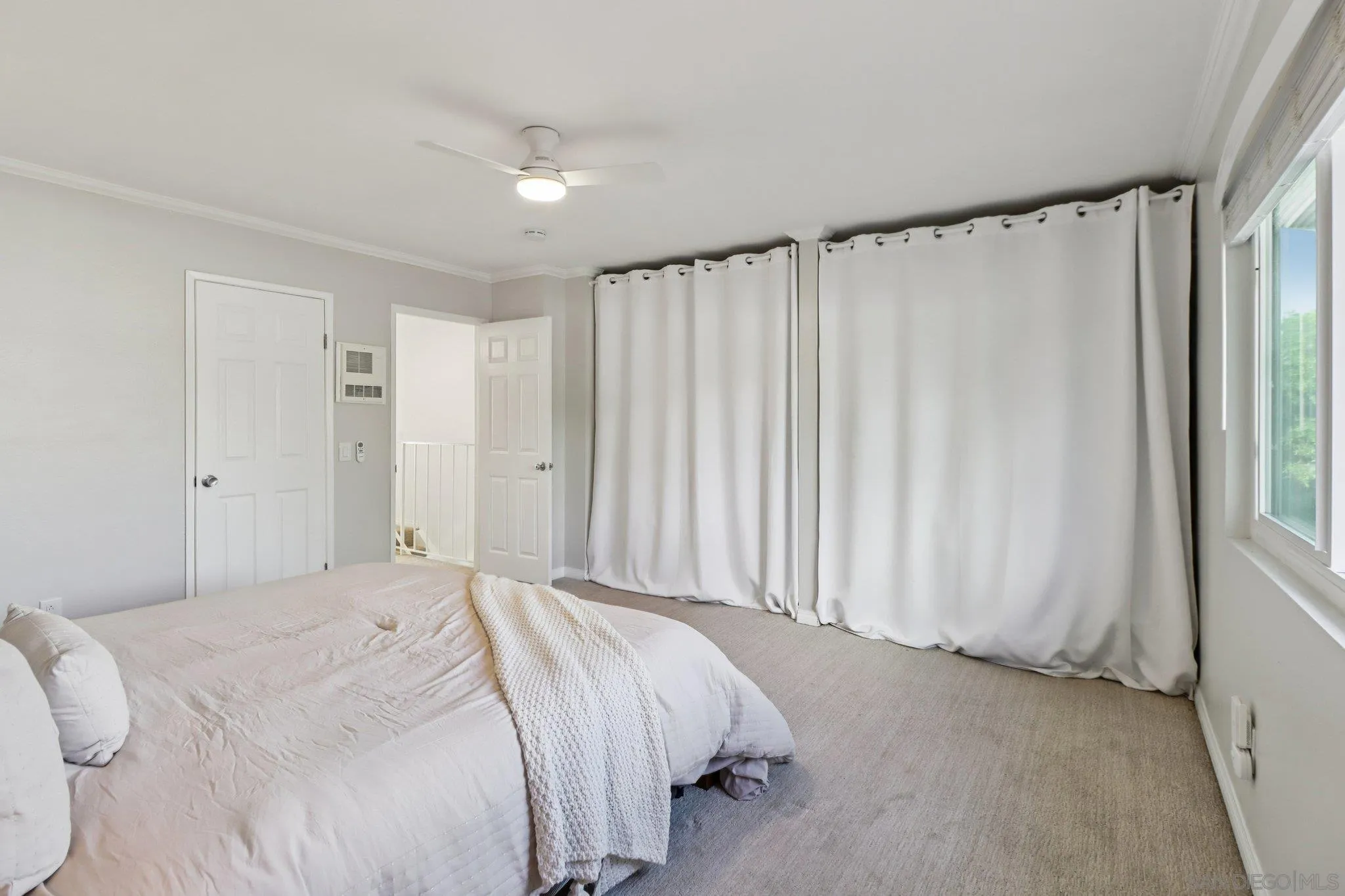 324 Countrywood Lane Encinitas, CA 92024 - Photo 19 of 42 a bedroom with a bed and a window