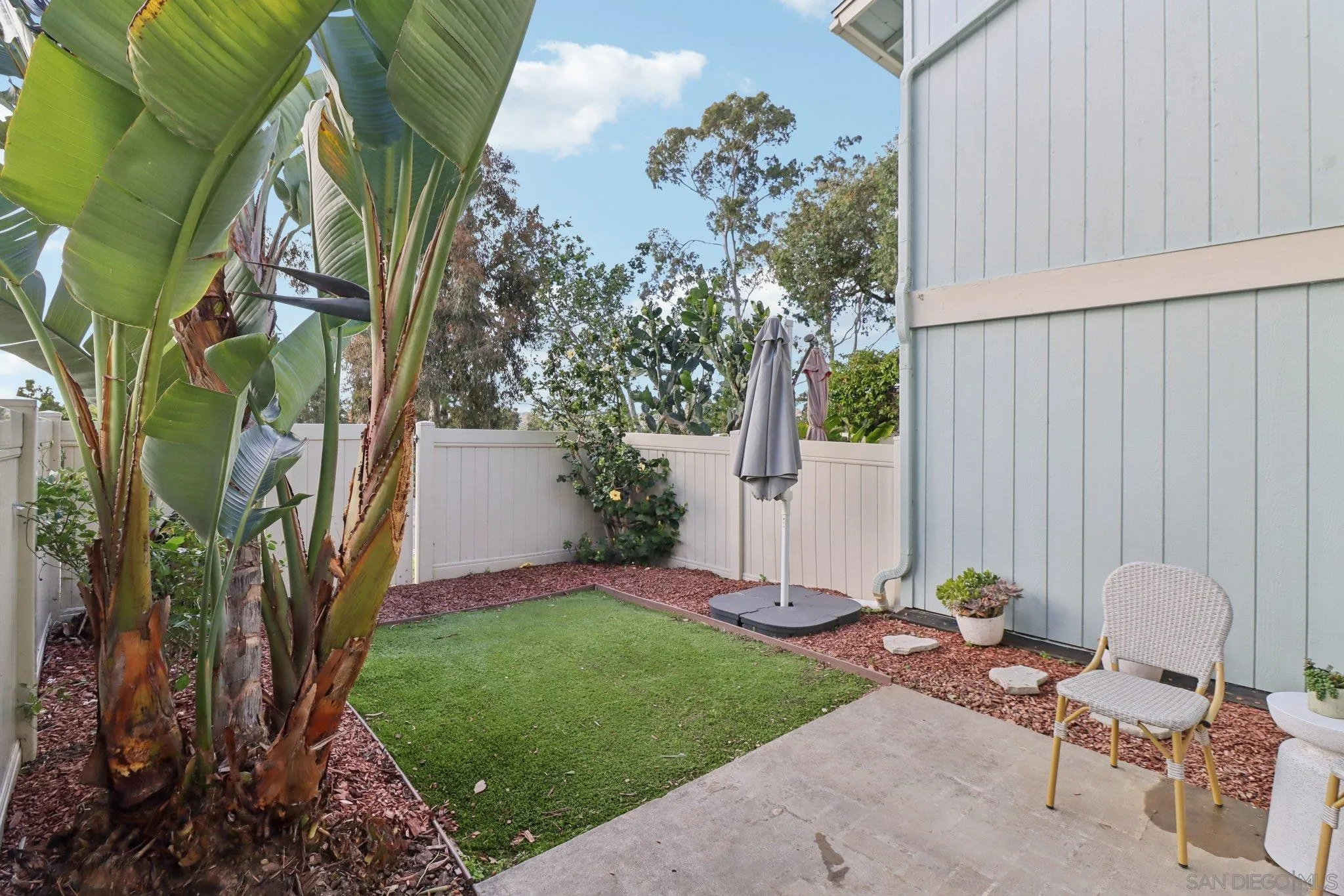 324 Countrywood Lane Encinitas, CA 92024 - Photo 24 of 42 a view of a chair and table in backyard