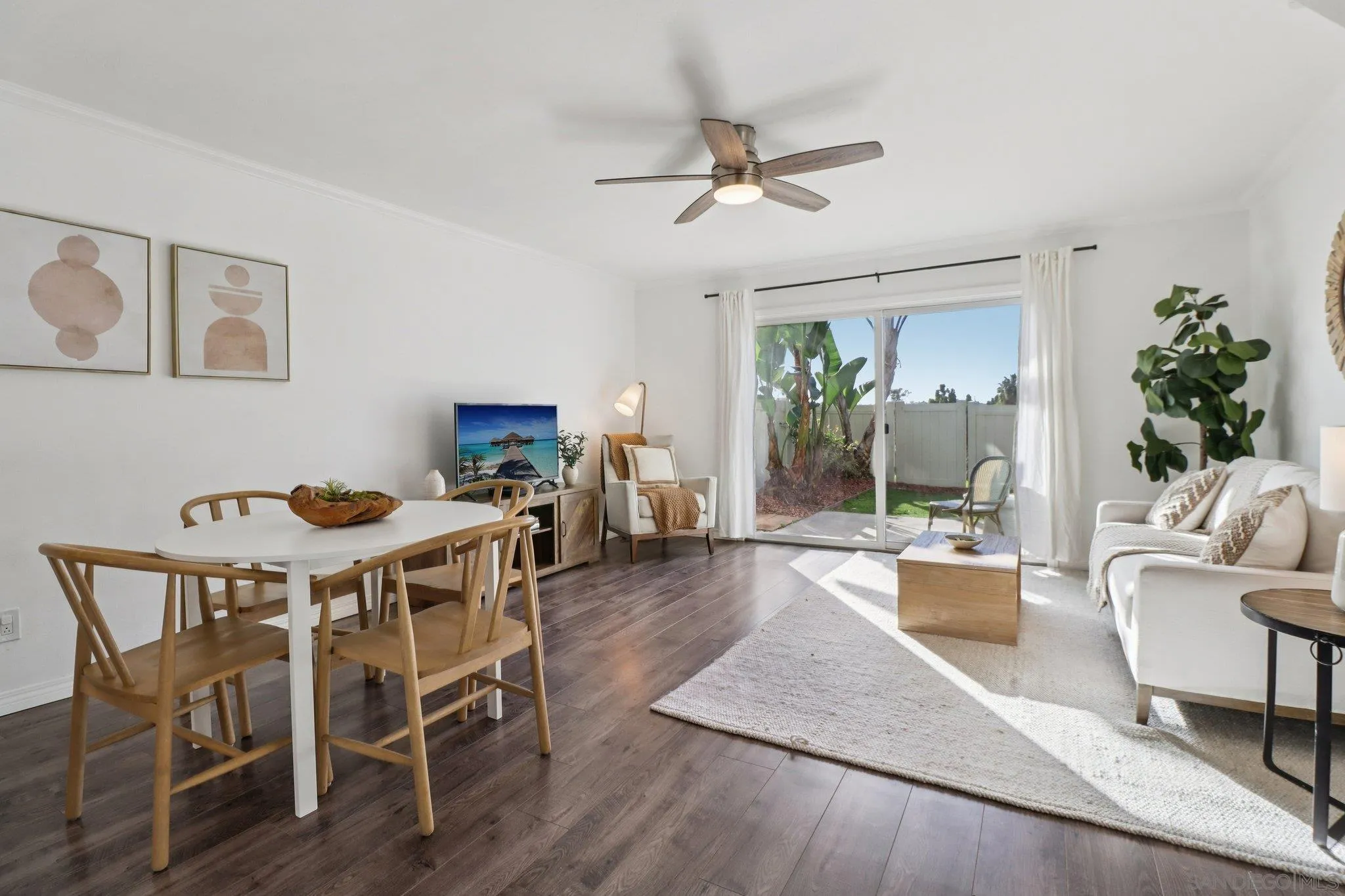 324 Countrywood Lane Encinitas, CA 92024 - Photo 6 of 42 a view of a livingroom and dining room with wooden floor a chandelier