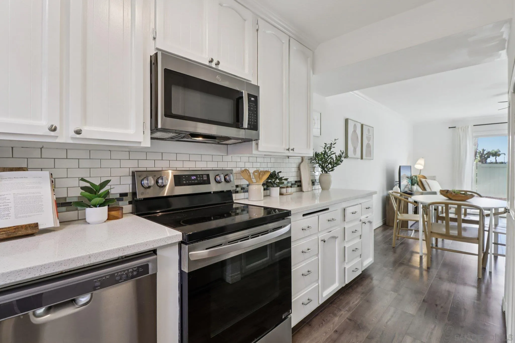 324 Countrywood Lane Encinitas, CA 92024 - Photo 8 of 42 a kitchen with a stove and a microwave