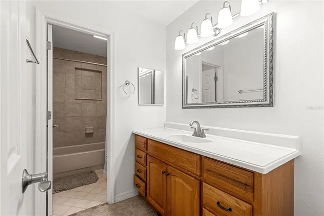 a white toilet sitting next to a bath tub