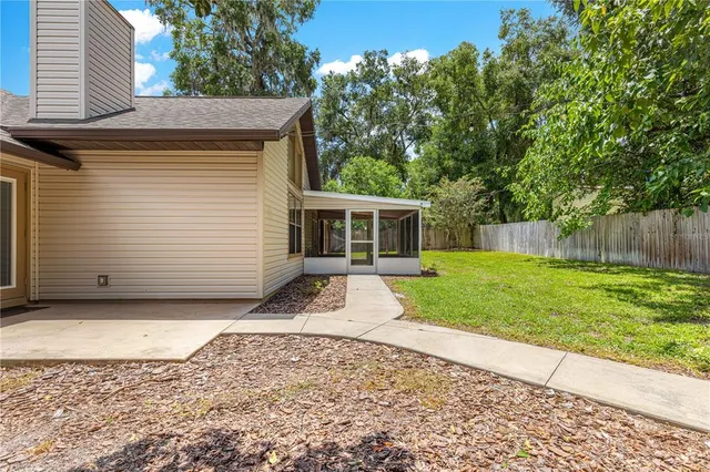 a house view with a backyard space