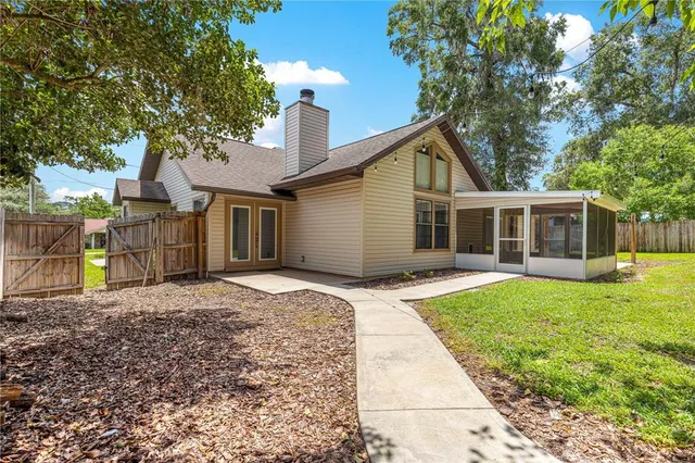 a view of a house with a yard and plants