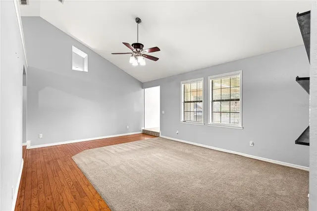 a view of an empty room with a window