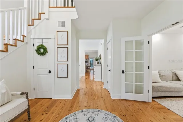 a spacious bedroom with a large bed and a dresser
