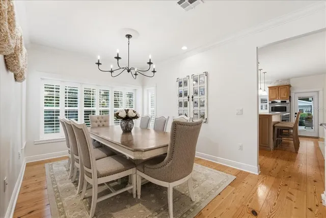 a bedroom with a large bed and a flat tv screen on dresser