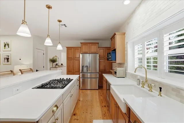 a view of a patio with a table and chairs