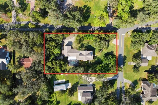 a view of a porch with chairs and backyard