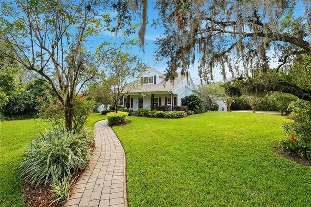 a view of a dining room with furniture and window