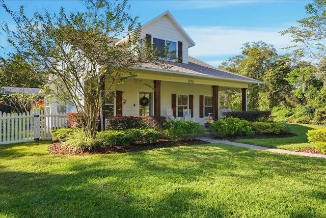 a kitchen with a stove a sink and a microwave