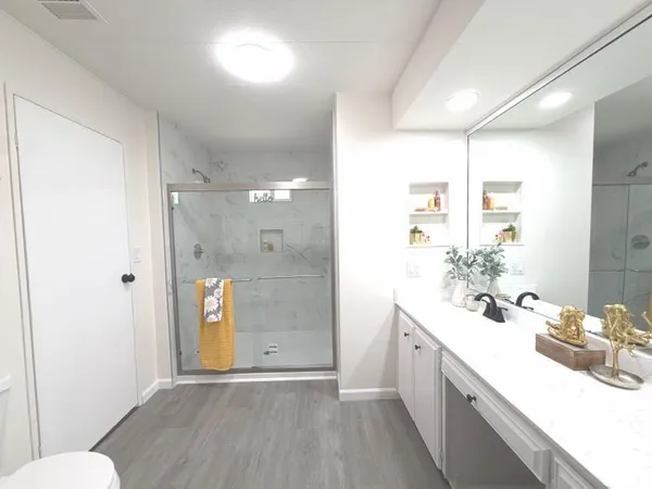 a bathroom with a sink and a mirror