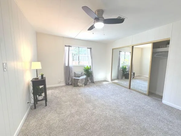 a view of a livingroom with furniture and a flat screen tv