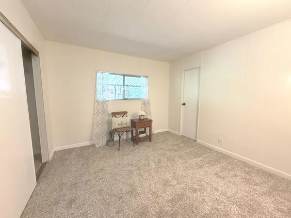 a view of workspace with furniture and window