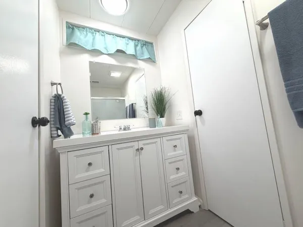 a bathroom with a sink and a mirror