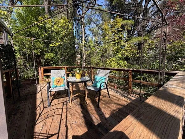 a view of a balcony with chairs