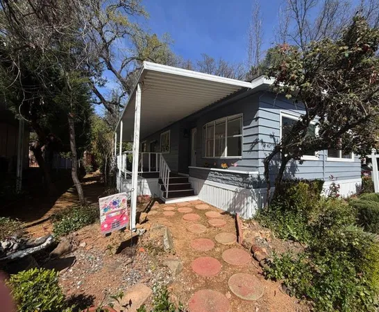 a backyard of a house with seating space