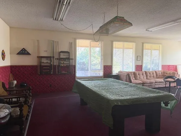 a kitchen with sink stove and window