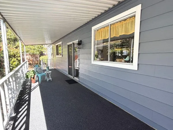 a view of a living room and floor to ceiling window