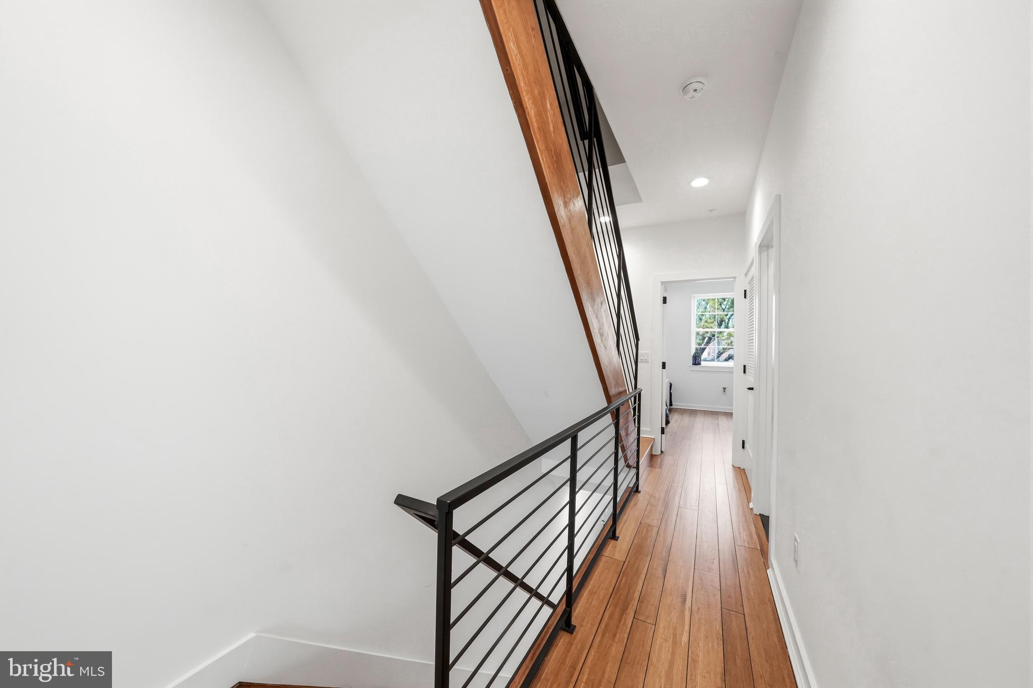 2604 Reed Street Philadelphia, PA 19146 - Photo 19 of 45 a view of a hallway with wooden floor and stairs