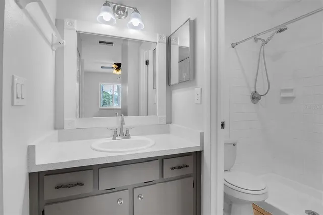 a room that has a toilet and a car in it