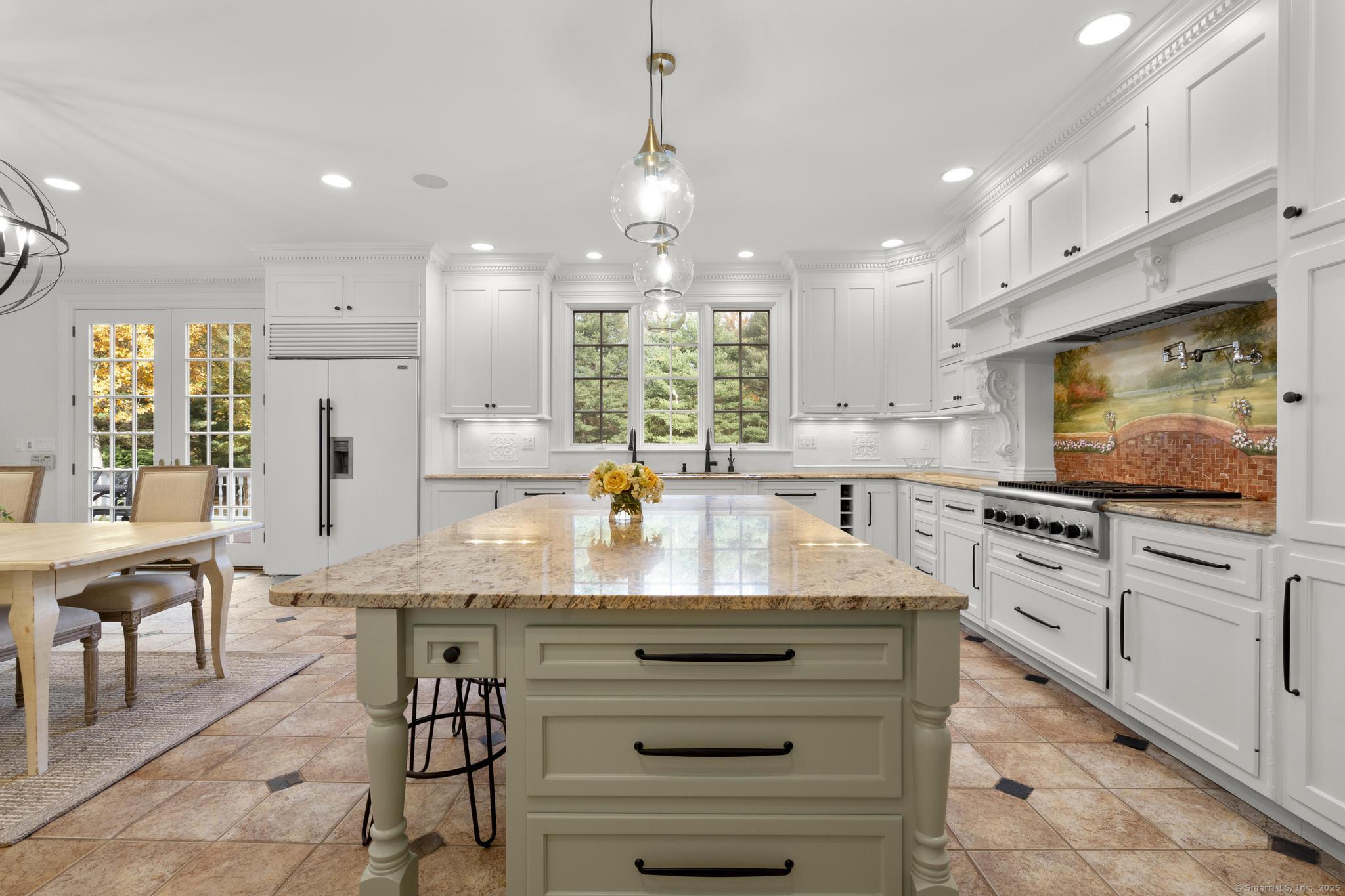 342 Midlock Road Fairfield, CT 06824 - Photo 11 of 40 a kitchen with stainless steel appliances granite countertop a stove and cabinets