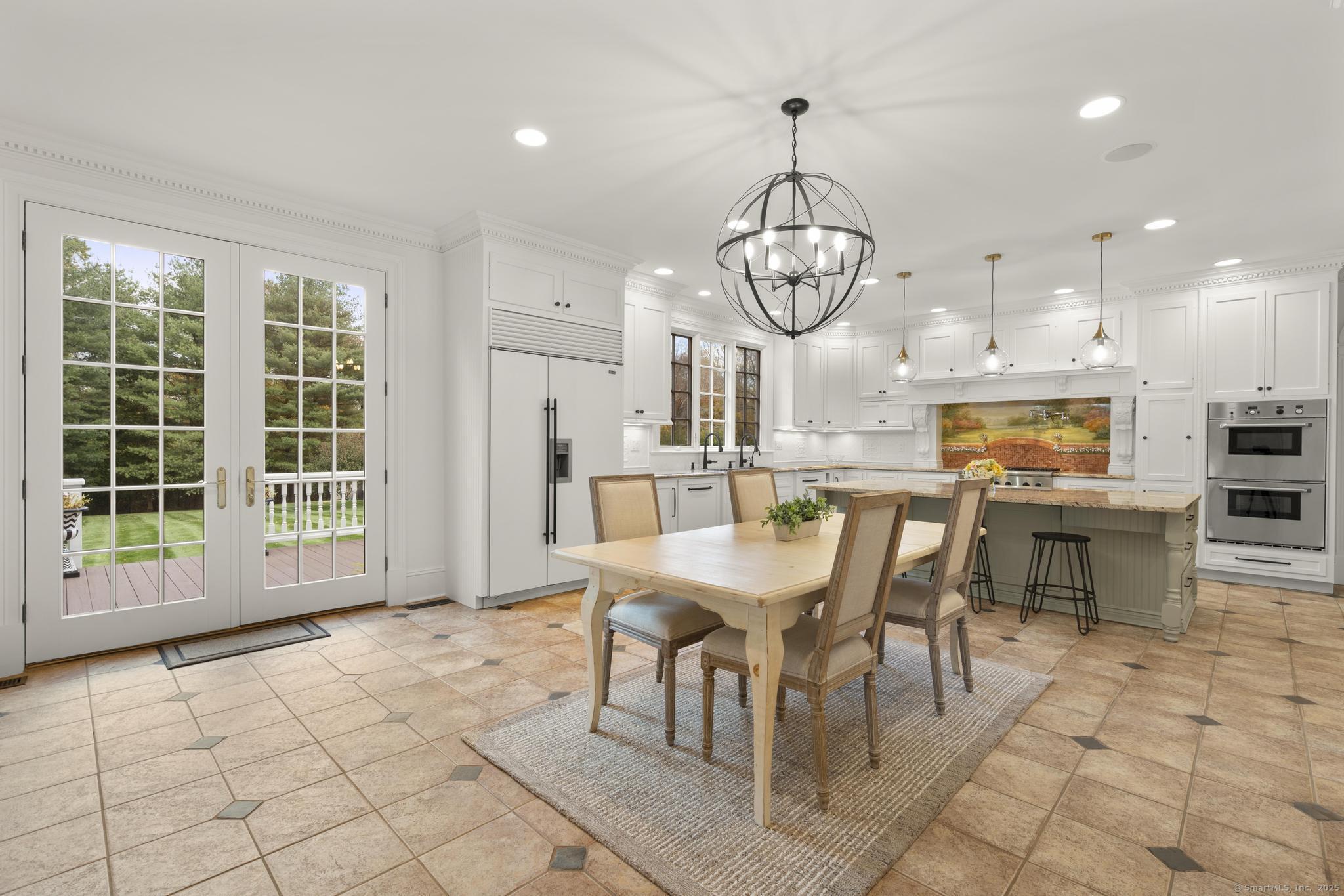 342 Midlock Road Fairfield, CT 06824 - Photo 13 of 40 a view of a dining room with furniture window and wooden floor