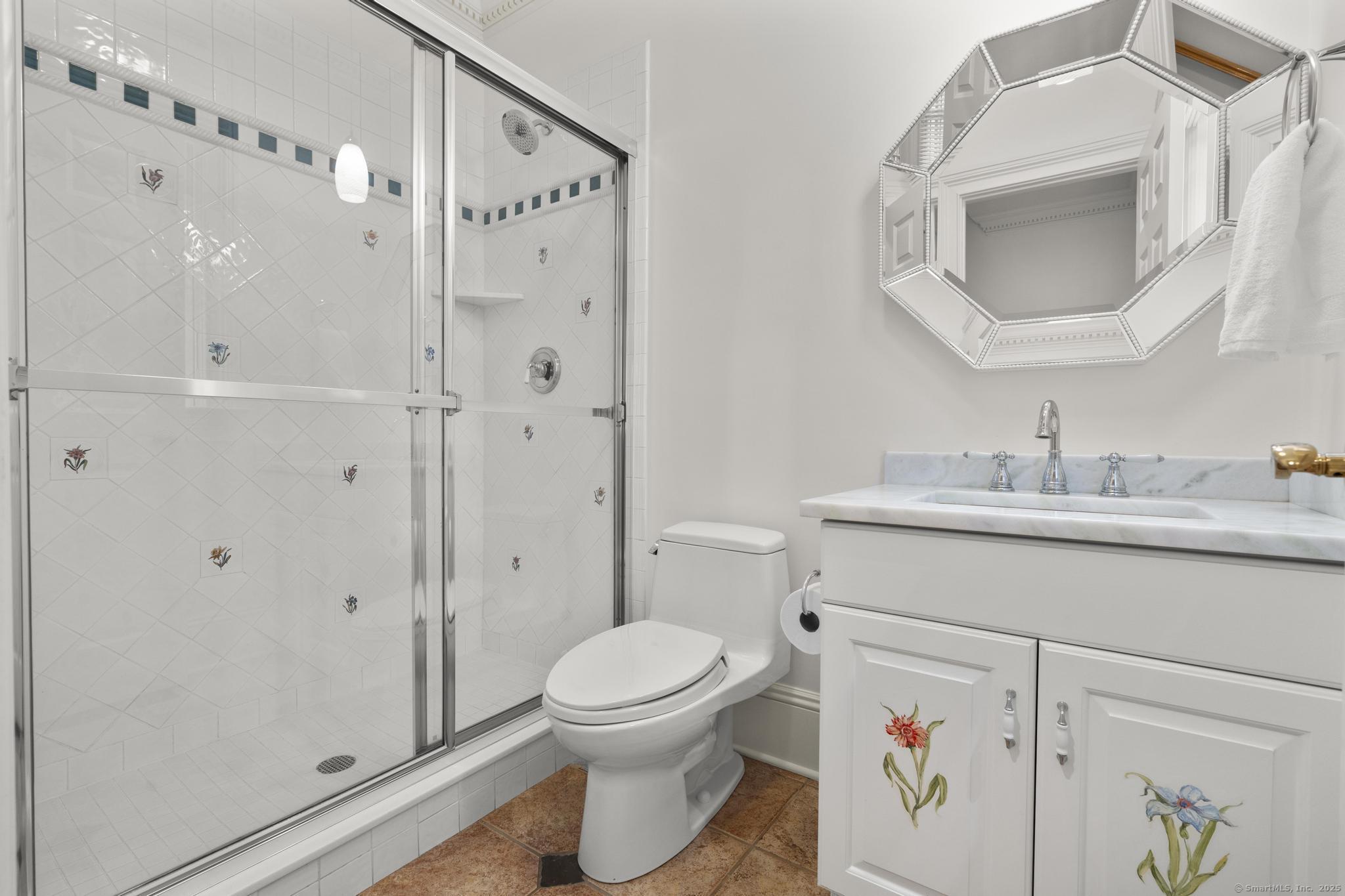 342 Midlock Road Fairfield, CT 06824 - Photo 16 of 40 a bathroom with a toilet a sink and a mirror