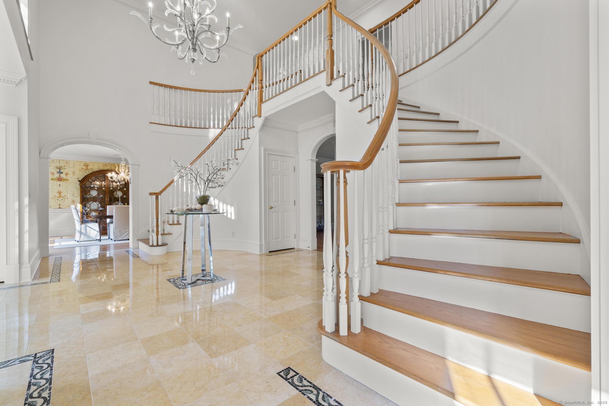 342 Midlock Road Fairfield, CT 06824 - Photo 17 of 40 a view of entryway and hall with a dining room view