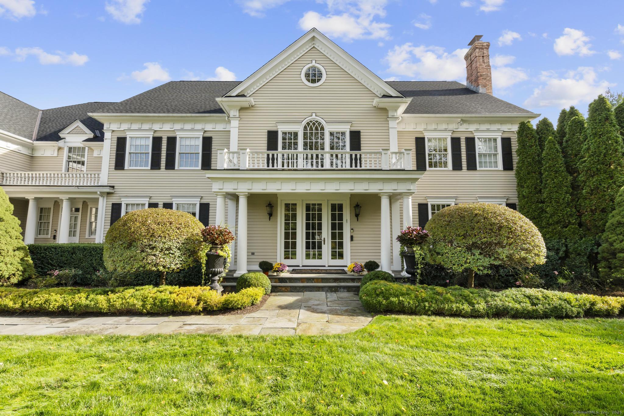 342 Midlock Road Fairfield, CT 06824 - Photo 2 of 40 a front view of a house with a yard