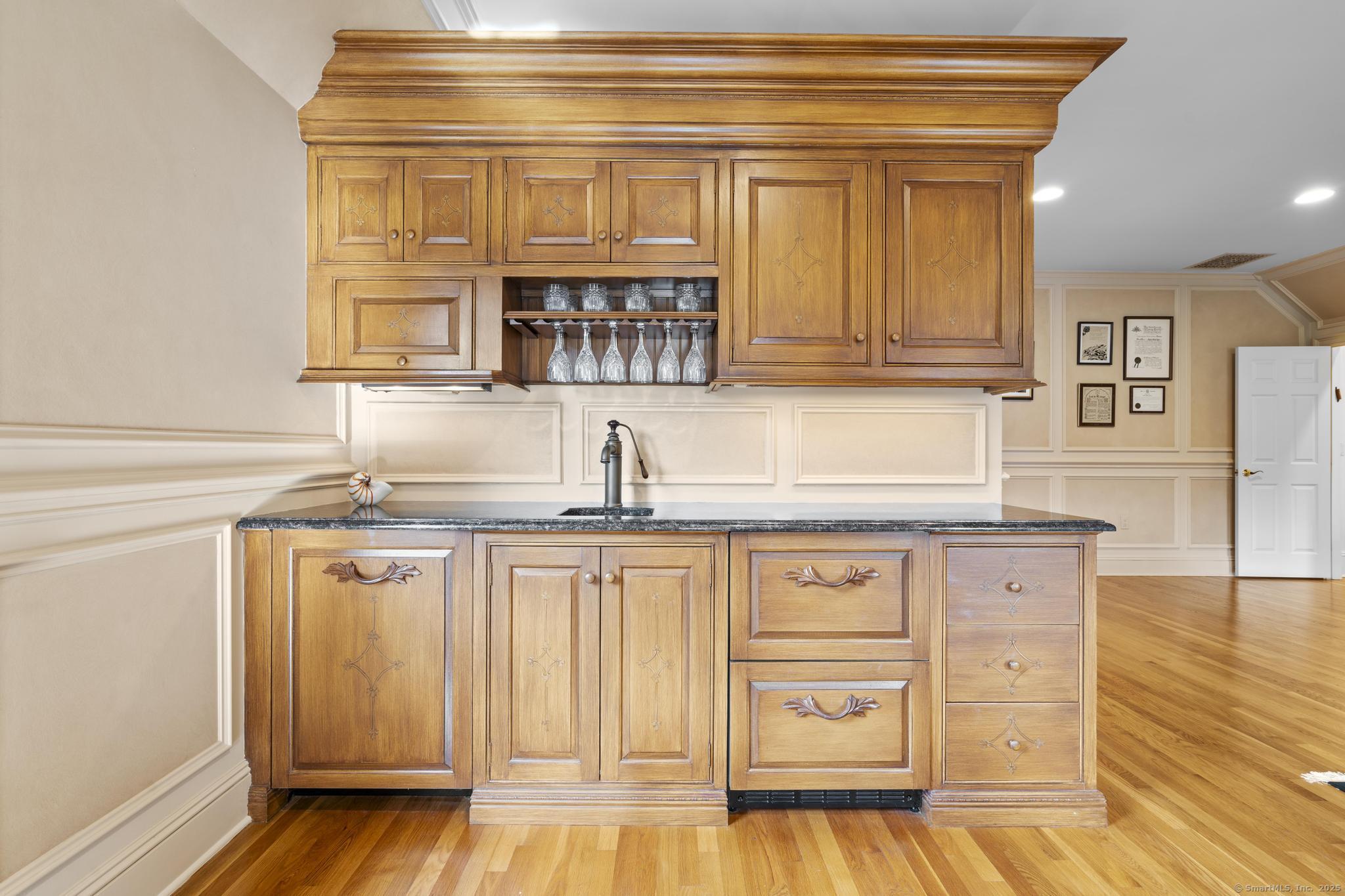 342 Midlock Road Fairfield, CT 06824 - Photo 23 of 40 a kitchen with stainless steel appliances granite countertop a sink and cabinets