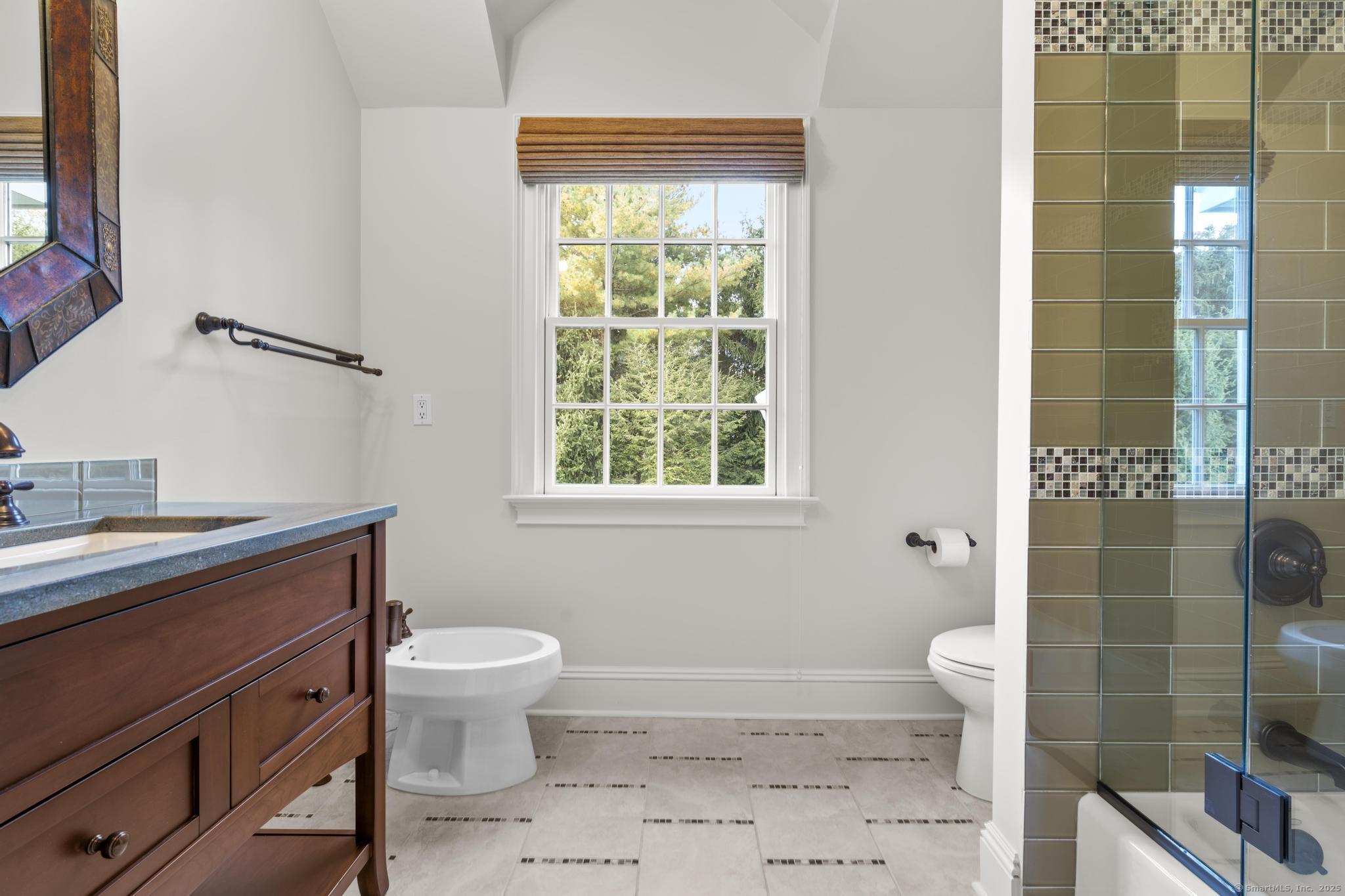 342 Midlock Road Fairfield, CT 06824 - Photo 25 of 40 a bathroom with a sink toilet and shower