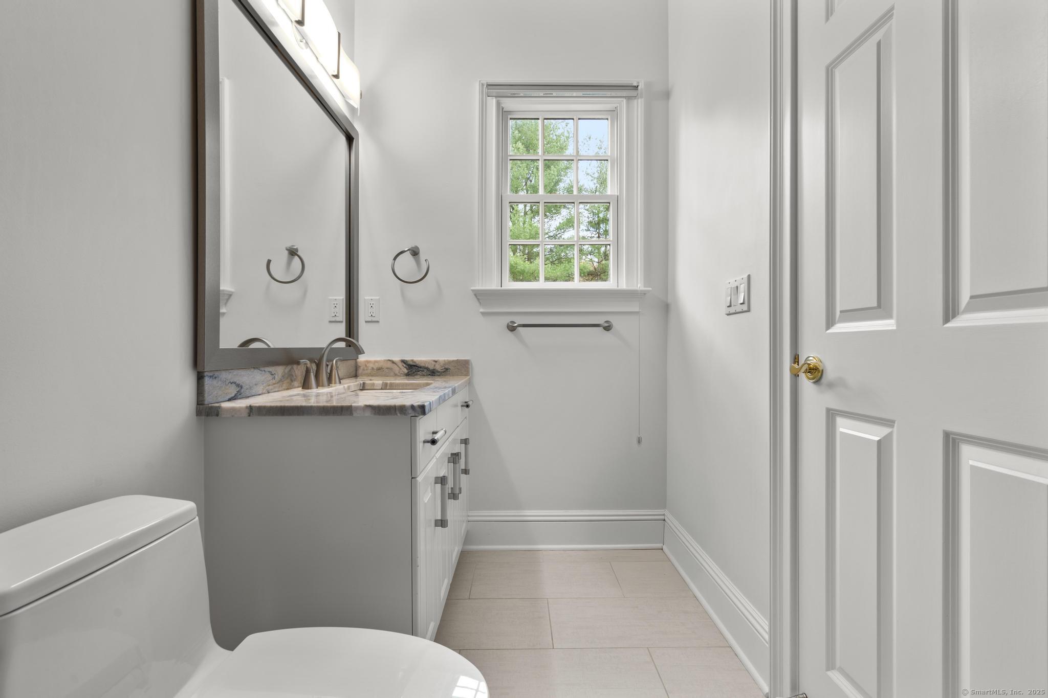 342 Midlock Road Fairfield, CT 06824 - Photo 27 of 40 a bathroom with a sink toilet and shower