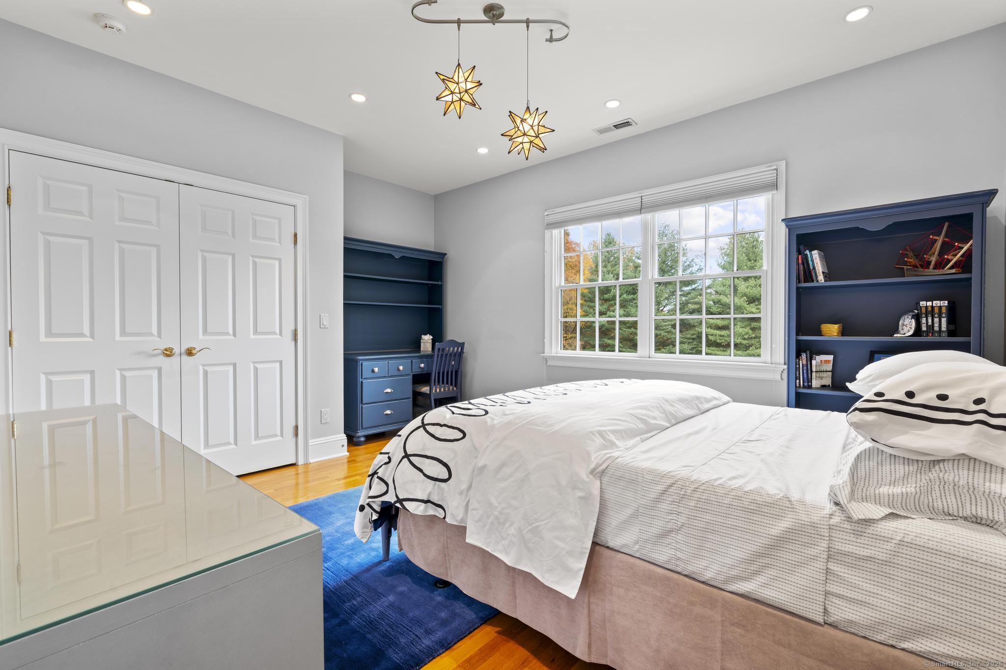 342 Midlock Road Fairfield, CT 06824 - Photo 28 of 40 a bedroom with a bed and a window