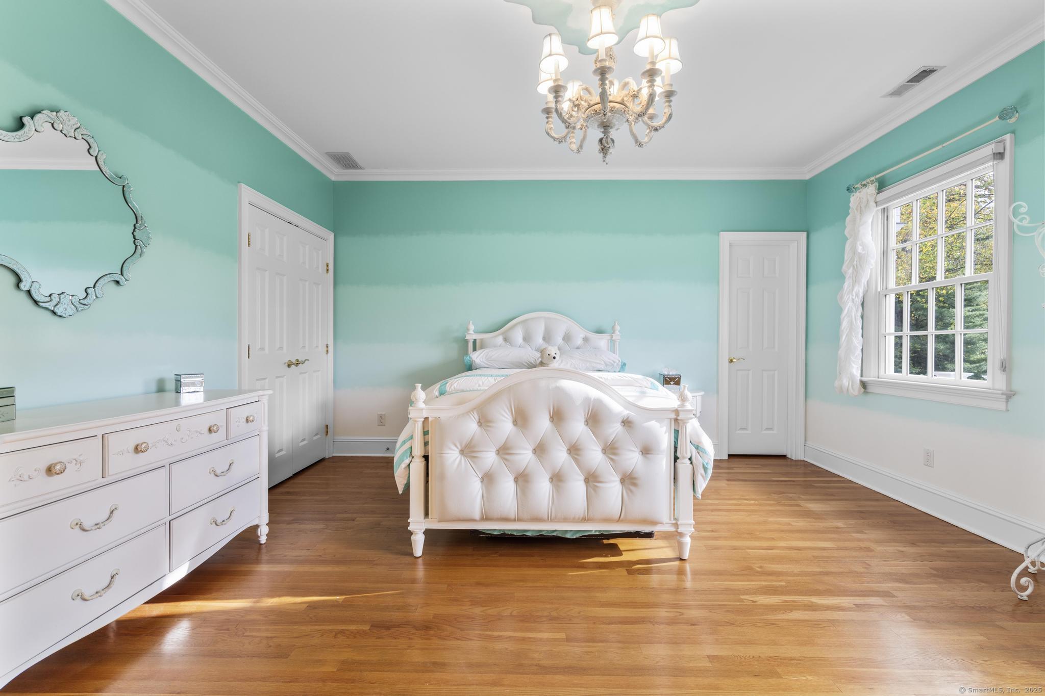 342 Midlock Road Fairfield, CT 06824 - Photo 30 of 40 a bedroom with a bed and window