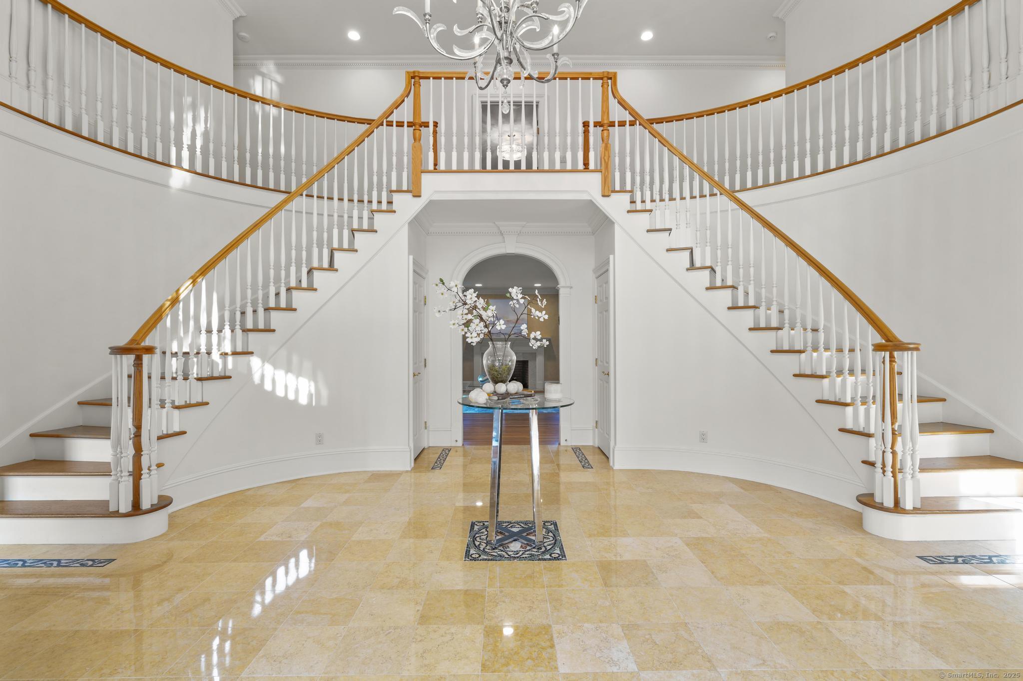 342 Midlock Road Fairfield, CT 06824 - Photo 3 of 40 a view of entryway and hall with wooden floor