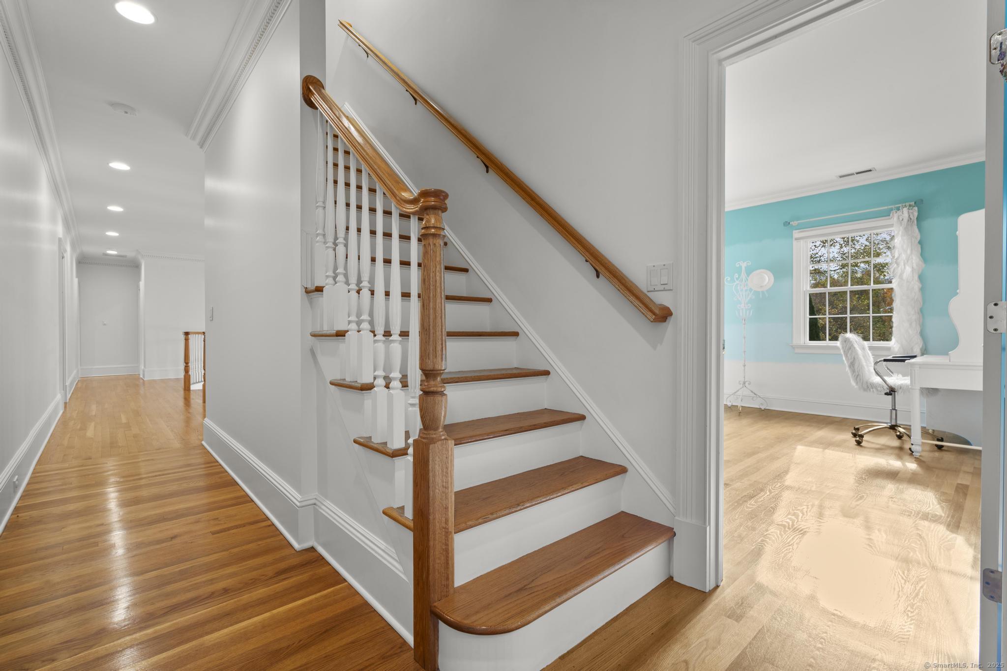 342 Midlock Road Fairfield, CT 06824 - Photo 32 of 40 a view of entryway and hall with wooden floor